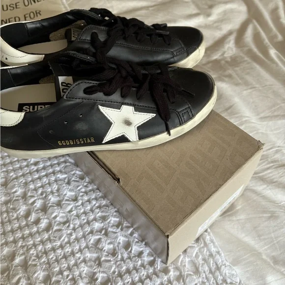 Golden Goose Black and White Superstar Sneakers - Picture 1 of 8